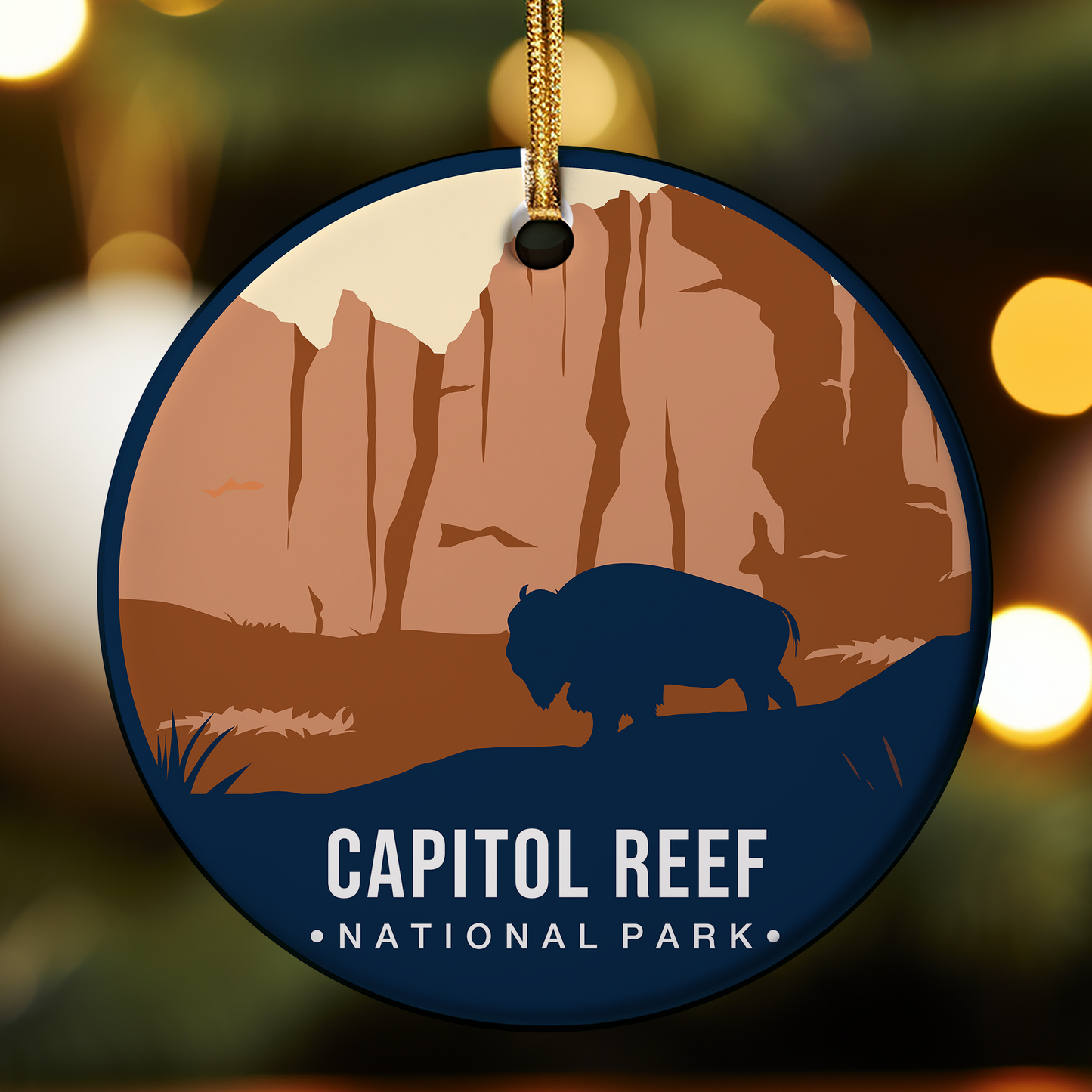 Ornament with Capitol Reef National Park design featuring a silhouette of a bison and cliffs.