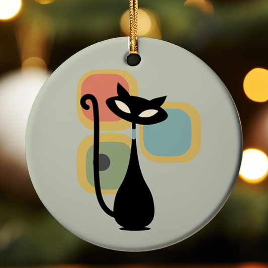 Decorative ornament with a black cat design on a light green background with colorful boxes.