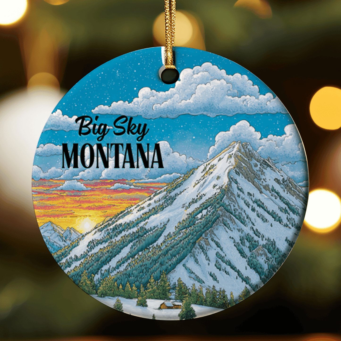 Round ornament with mountain scene and 'Big Sky Montana' text, hanging against a blurred light background.