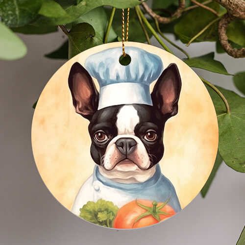 This Everyday Ornament is of a whimsical painting of a black and white Boston terrier with brown eyes, wearing a chefs outfit and hat. The background is a sponge paint Tuscany eggshell color, the dog chef hold a giant ripe beefsteak tomato and a head of romaine lettuce.