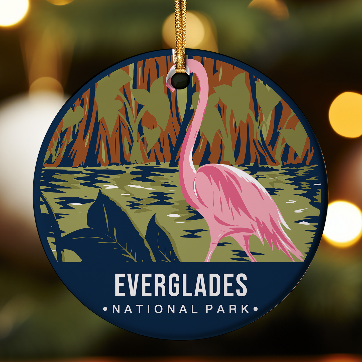 Circular ornament with pink flamingo and Everglades National Park text on a blurred nature background