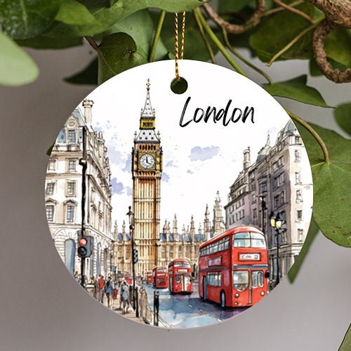 This holiday ornament displays London’s red transport busses driving down the road in single file as Big Ben overlooks them on a lightly cloudy scattered sky.