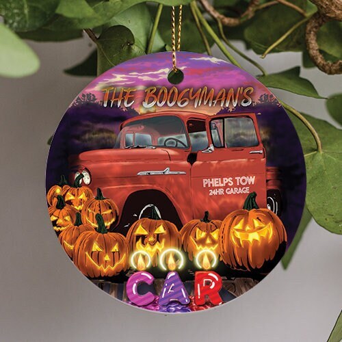 This holiday ornament displays a rusted vintage chevy tow truck lined with glowing halloween pumpkins. Informing trick r treaters to beware the Boogeyman’s Car.