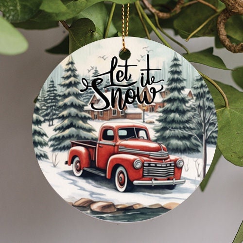 This holiday ornament displays a retro rustic red pick up truck parked just in front of a small frozen pond. As birds fly south over the cabins in the rear as the pine trees provide a holiday feel to this softly lit Rockwell style illustration.