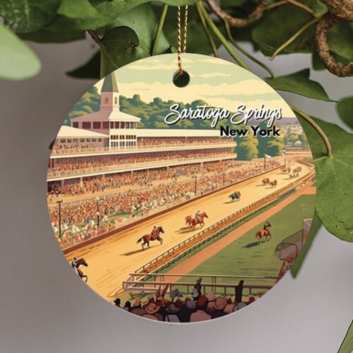 This holiday ornament displays Saratoga Springs New York and their famous race track. Jockeys and fans cheer as the race commences on a warm spring sky and lush trees in the background.