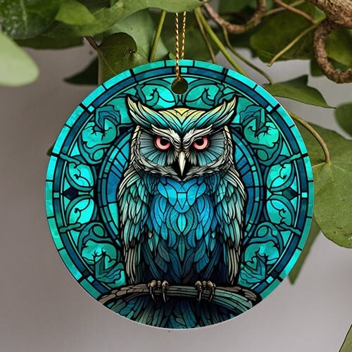 This holiday ornament shows a Great Horned Owl with its long ear like Tufts and pensive stare as stained glass. In a varying color of beautiful turquoise.