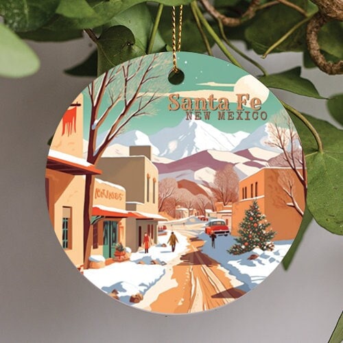 This holiday ornament contains the backdrop of the Rockies during a cool winer day. Snow covered sidewalks with shoppers abound. A old vintage cars is parked off to the right and Christmas tree in the front.