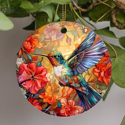 This holiday ornament is of a vibrant colorful hummingbird in flight looking for the next flower on a spring day.