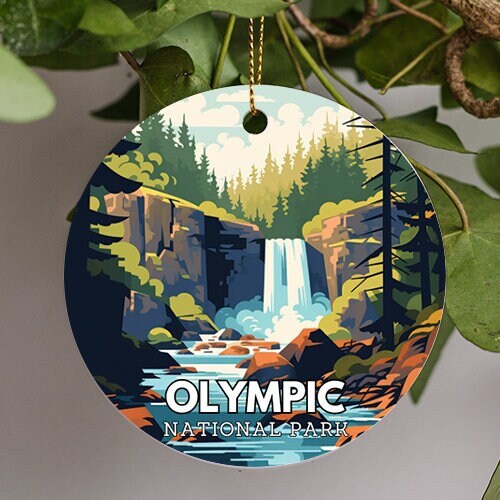 This ornament is of Olympic National Park in Washington State on a warm summers day pine trees back point high into the soft cool blue sky. A waterfall cascades into clouds before the flowing river running through the middle of the illustration.