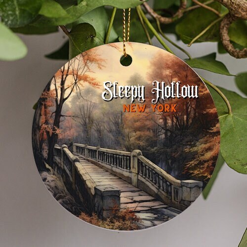 This ornament displays a woodland of autumn tress that are just turning providing a warm feeling to a gloomy cold day with an old Dutch stone walkway bridge in legendary Sleepy Hollow New York during sun rise.