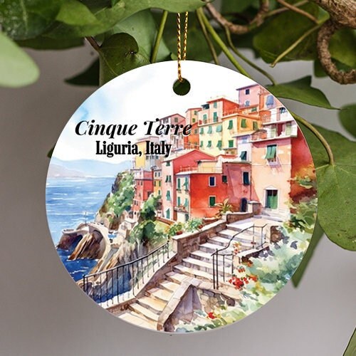 This ornament is of watercolored Cinque Terre Liguria Italy. Soft brush strokes display the colorful homes and terraces which look down upon the harbor through the cliffside sea vistas of cool softly rippling water.