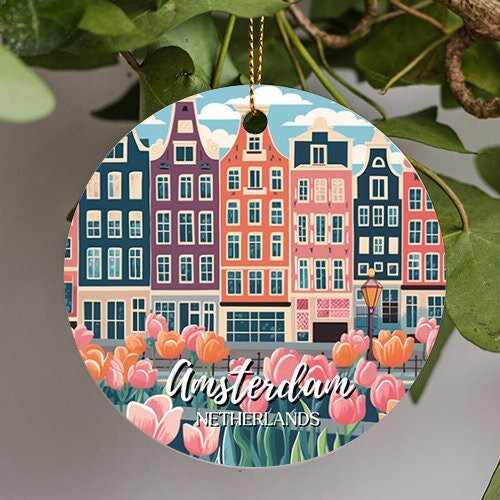 This ornament is of Amsterdam in the Netherlands in a jazzy retro illustration of their colorful building in this mid ground during a clear cloudy blue sky as various warm spring colored Tulips appear in the bottom foreground.