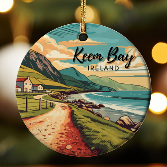 Decorative ornament with a scenic illustration of Keem Bay, Ireland, on a blurred background.